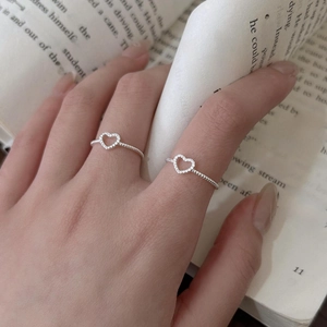925 sterling silver heart open rings featuring delicate bead textures on a model's hand