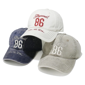 Retro washed cotton baseball caps with Gorgeous 86 embroidery in cream, blue, and khaki