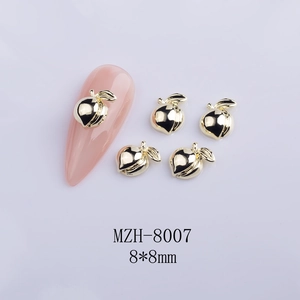 Detailed 8x8mm gold peach heart nail art charms with polished metallic mirror finish