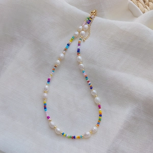 Bohemian colorful beaded necklace with freshwater pearls and gold extension chain detail