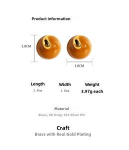 Detailed view of handmade brown enamel round stud earrings with brass gold spiral and 925 silver needle
