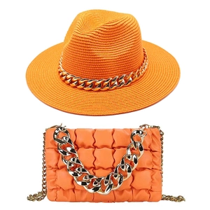 Vibrant orange fedora straw hat and matching quilted chain handbag set for women