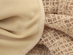 Detailed close-up showing khaki lace mesh fabric with precise stitched seam work