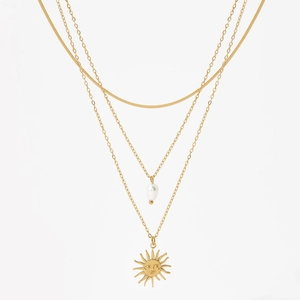 Gold layered stainless steel necklace with sun pendant and white baroque pearl charm