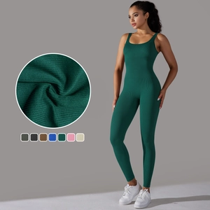 Deep green seamless ribbed yoga jumpsuit for women with slim fit and elastic fabric