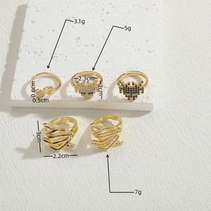 Collection of gold geometric zircon rings featuring layered waves and pixel heart designs