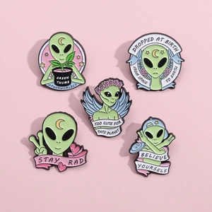 Set of 5 cute green alien enamel pins featuring unique outer space themes on pink background