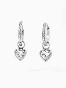 Close-up of heart-shaped crystal drop earrings with sparkling cubic zirconia inlay