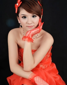 Detailed close-up of red lace banquet gloves with satin bow and delicate embroidery