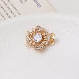 Macro shot of 14K gold-plated flower clasp with micro-set zircons for jewelry making