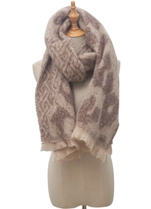 Detailed view of the soft beige and brown leopard print scarf with fine fringe trim