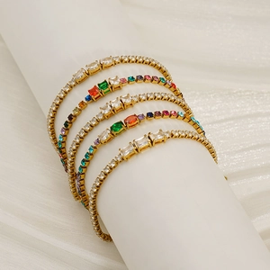 Classic 3mm tennis bracelets with gold plating and multicolor zirconia on white pedestal