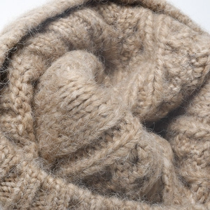 Thick jacquard knit camel beanie with fluffy long-haired wool texture for winter warmth