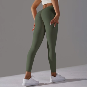 Detail of olive green yoga leggings showing V-waist and scrunch butt lifting design