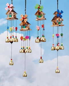 Detail of wooden windmill wind chimes in four colors with retro metal bells