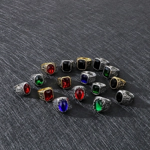 Group display of vintage Viking rings with colorful gemstones and carved steel bands