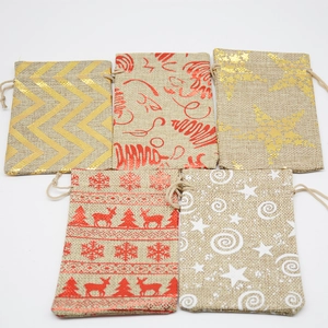 Christmas burlap drawstring gift bags with gold foil stars and reindeer patterns