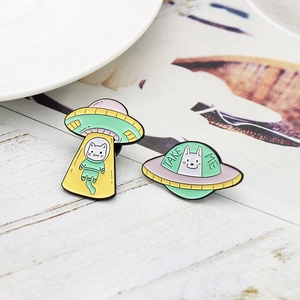 Cute cartoon cat astronaut and UFO enamel pins set with Take Me text on wood background
