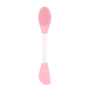 Detailed close-up of a pink dual-head silicone face mask brush with scraper and soft bristles