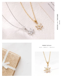 Detail of silver and gold flower necklaces with marquise-cut zircons on a soft fabric