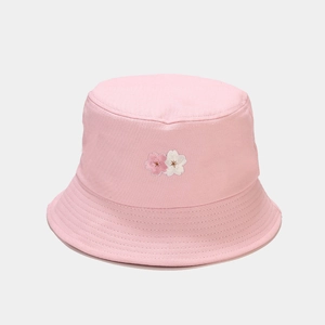 Detail of pink cotton bucket hat featuring delicate cherry blossom floral embroidery