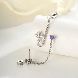 Silver chain double piercing earrings with heart zircon and crystal cross detail