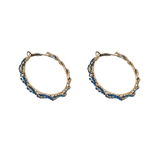 Elegant gold-tone hoop earrings with sparkling blue rhinestones in twisted design