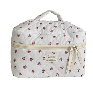 Quilted cotton makeup bag with red cherry pattern, dual zippers and top handle strap
