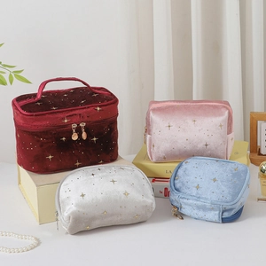 Detailed collection of velvet cosmetic bags with gold star patterns in four colors