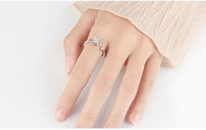 On-model view of silver spinning ring with zircon hex star for anxiety relief