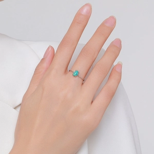 S925 sterling silver oval opal ring with delicate chain band on model hand