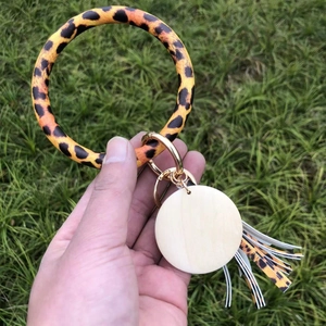 Leopard print PU leather bracelet keychain with gold metal clasp and white charm pendant