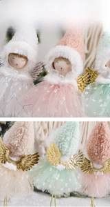 Detail view of plush Christmas angel dolls with sequin gauze skirts and golden wings