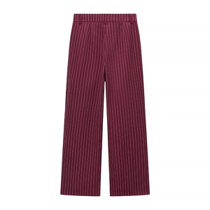 Detailed view of burgundy pinstripe straight-leg trousers with belt loops and smooth fabric