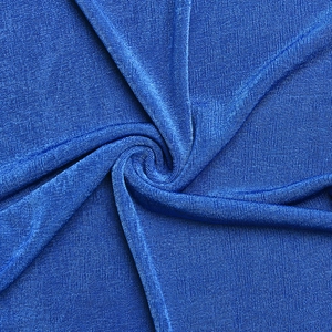 Detailed macro shot of bright blue elastic knitted fabric texture and sheen