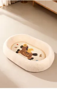 Close-up of soft beige teddy fleece pet bed with cartoon horse embroidery detail