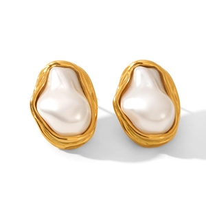 Detail of irregular gold metallic frame with large white baroque pearl earring