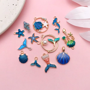 Marine DIY alloy charms set with blue enamel mermaid tails and starfish ornaments