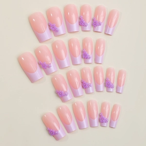 French press-on nails with long trapezoid shape featuring purple 3D floral designs