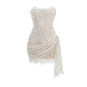 Detail of white lace tube dress with corset boning and sheer irregular hemline
