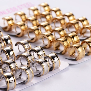 Polished stainless steel hoop earrings in gold and silver finishes on display card