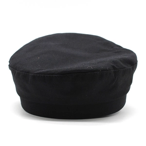 Detailed close-up of a minimalist black cotton canvas beret with thick durable fabric