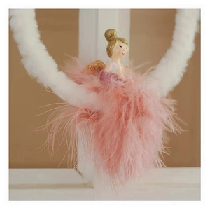 Detail view of pink feather angel plush doll with resin features on a white hanging ring