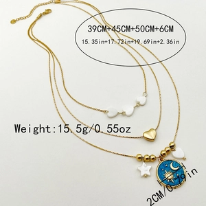 Detailed view of triple-layered gold necklace with sun moon enamel and heart charms