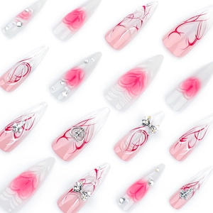 Pink 3D gradient stiletto press-on nails with silver metal bow and heart charms
