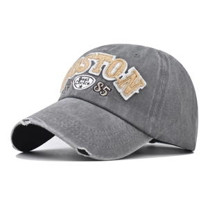 Close-up of vintage grey washed cotton baseball cap with yellow Boston embroidery