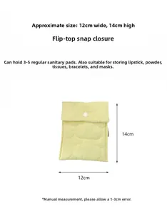 Close-up of a yellow quilted sanitary pad storage pouch measuring 12x14cm with snap closure