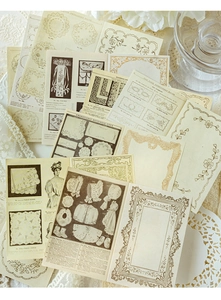 Detail of vintage scrapbooking paper set with lace patterns and retro embroidery designs