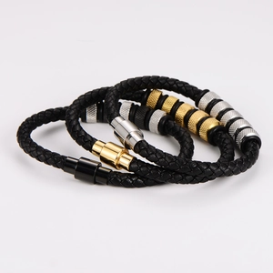 Detailed view of punk braided leather bracelets with gold, silver, and black metal clasps