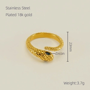 Detailed view of 18K gold plated stainless steel snake ring with blue zircon eye inlay